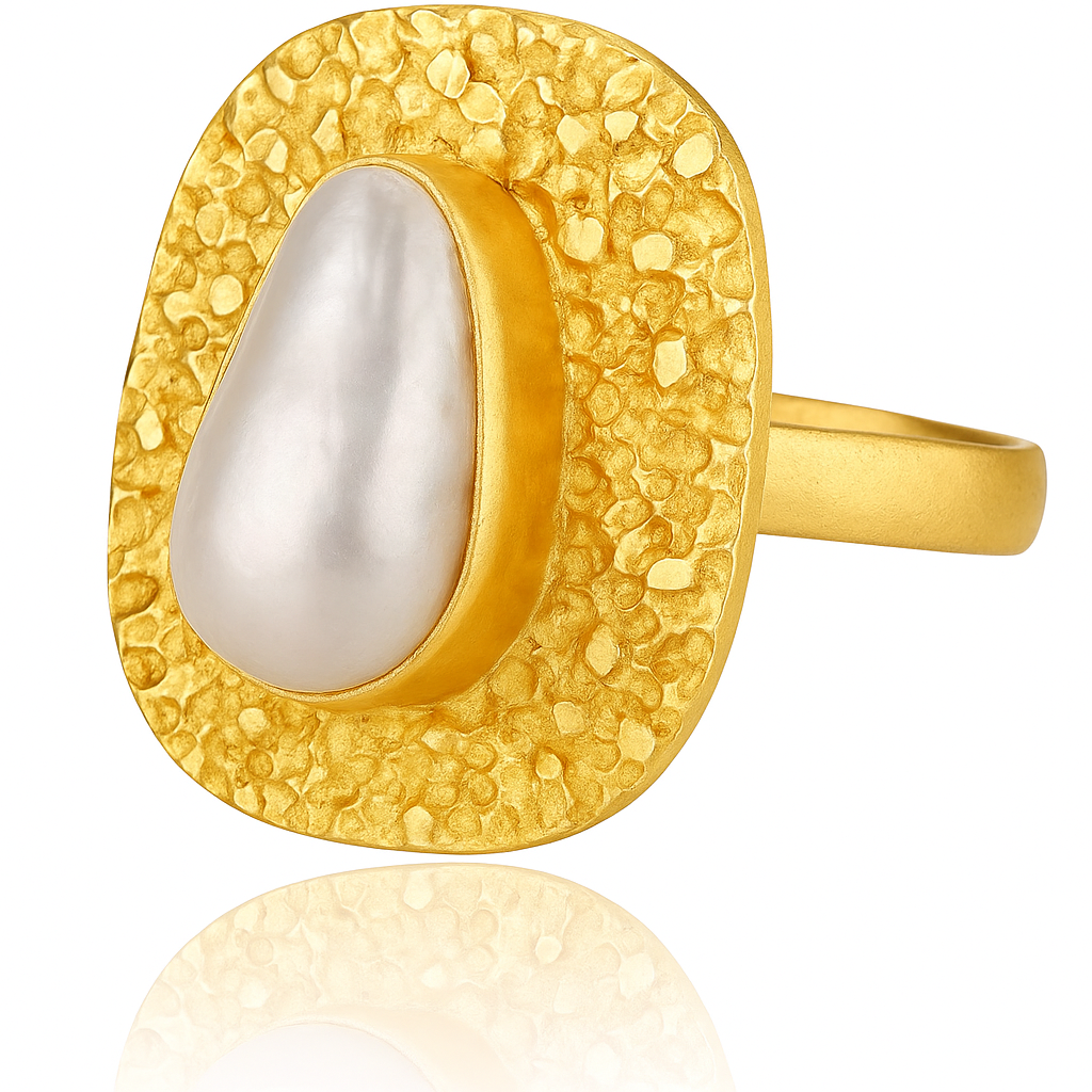 Gold ring with a textured band and central pearl on a white background